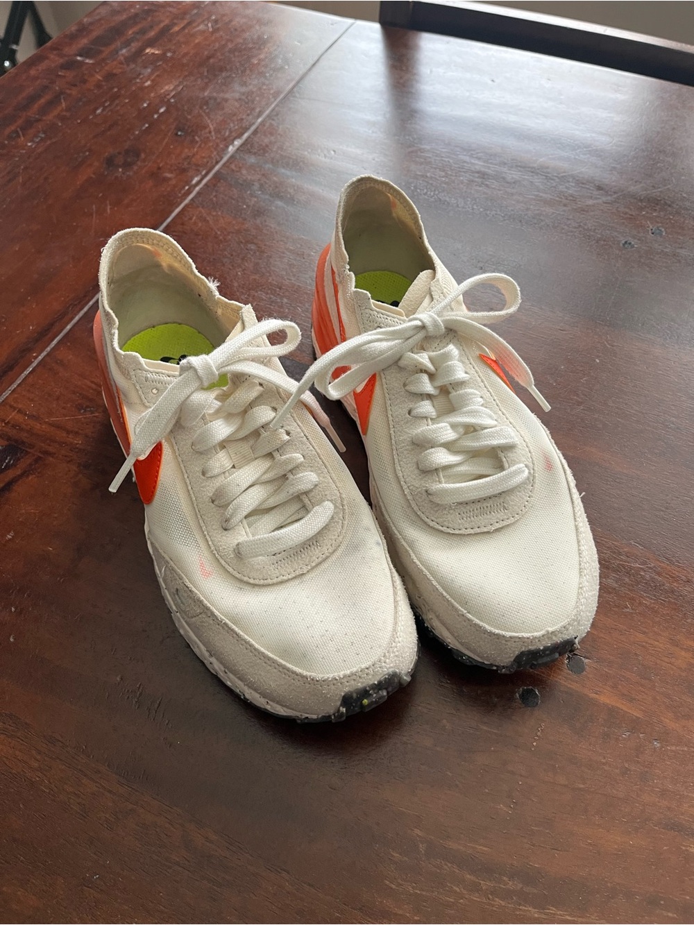 Nike White Low-Top Sneakers with Orange Swoosh and Neon Green Insole